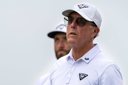 June 13, 2023, Los Angeles, California, USA: Golfers Phil Mickelson (right) and Jon Rahm (left) watch a member of their